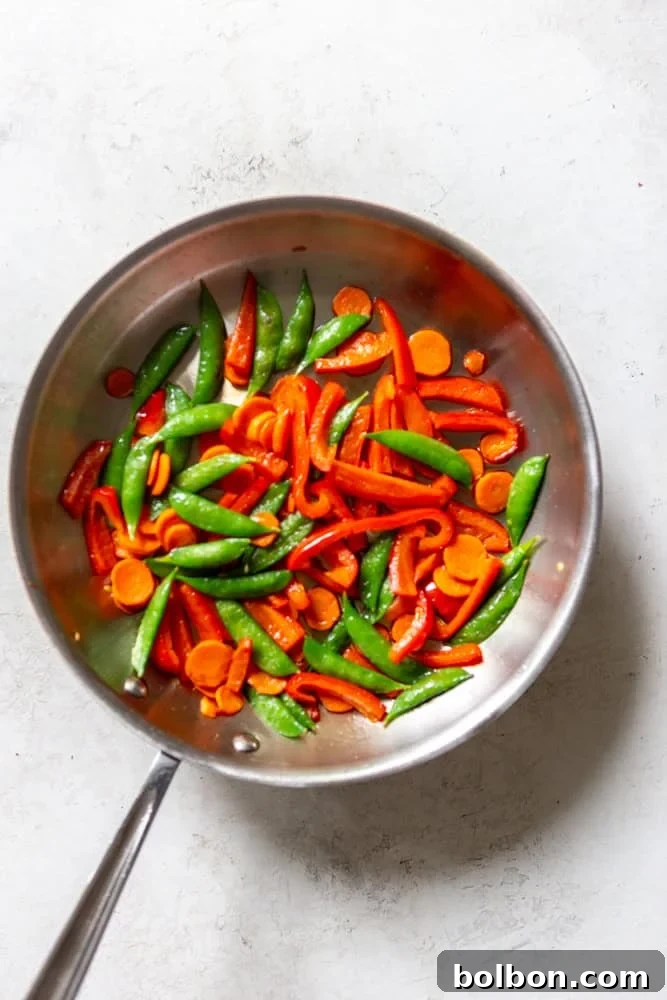 Vegetables being cooked in a pan.