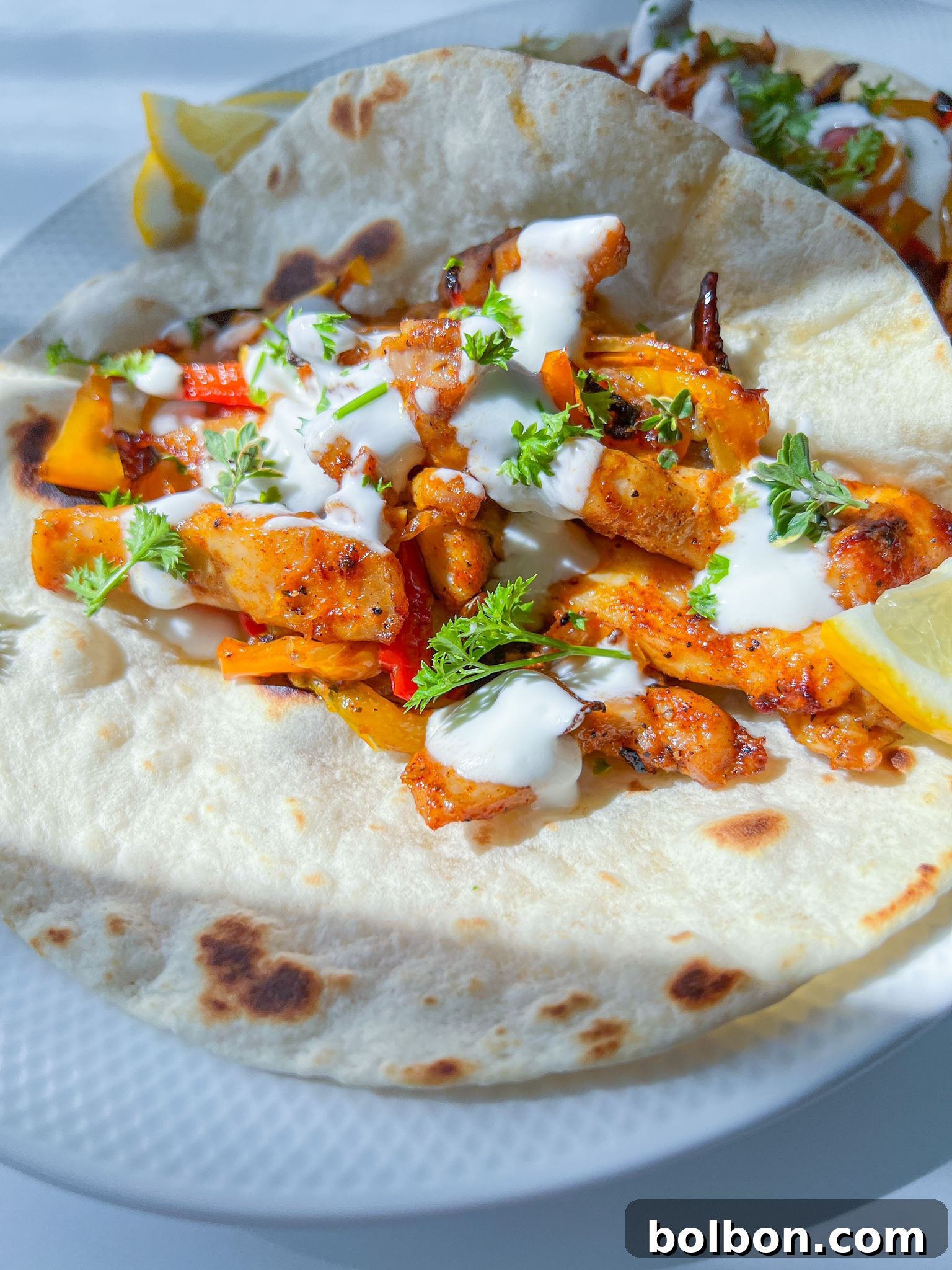 Sizzling chicken fajitas with colorful bell peppers and onions, ready to be served in warm tortillas.