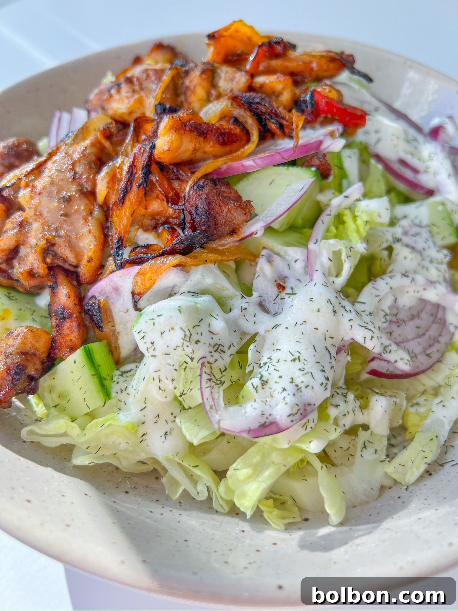 A vibrant bowl of Chicken Fajita Salad with succulent chicken, colorful vegetables, and a creamy dressing. Perfect for a healthy Tex-Mex inspired meal.