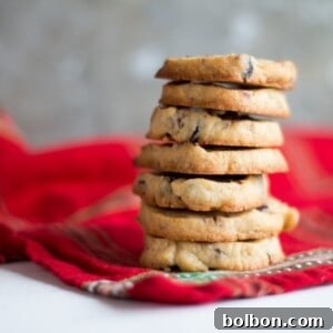 Cranberry Orange and Pecan Shortbread cookies. These easy, slice and bake cookies are flavored with orange zest, vanilla, cranberries and pecans. They are the perfect holiday cookies to give away or keep for yourself!