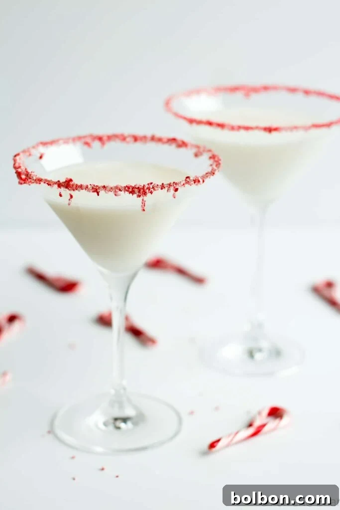 This sweet holiday martini has lots of peppermint and vanilla flavor, just like a peppermint marshmallow! A deliciously festive and visually appealing cocktail recipe, perfect for holiday celebrations.