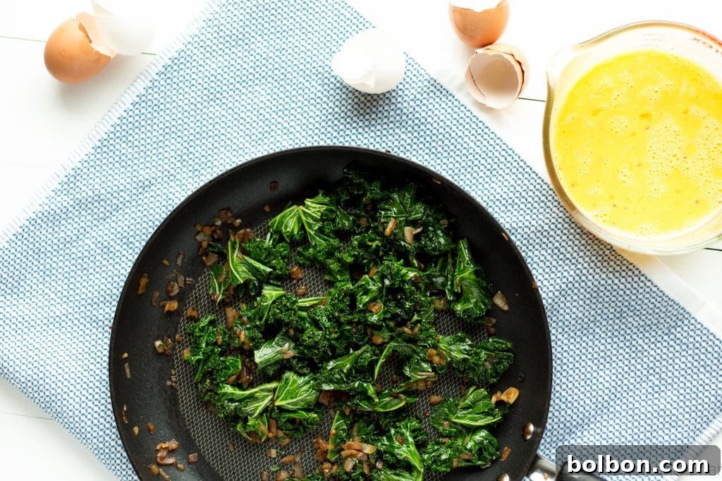 Close-up of a perfectly baked sausage and kale egg muffin