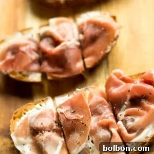 Fig, Prosciutto, and Creamy Chèvre Crostini 9 A plate of freshly prepared Fig, Goat Cheese and Prosciutto Bruschetta