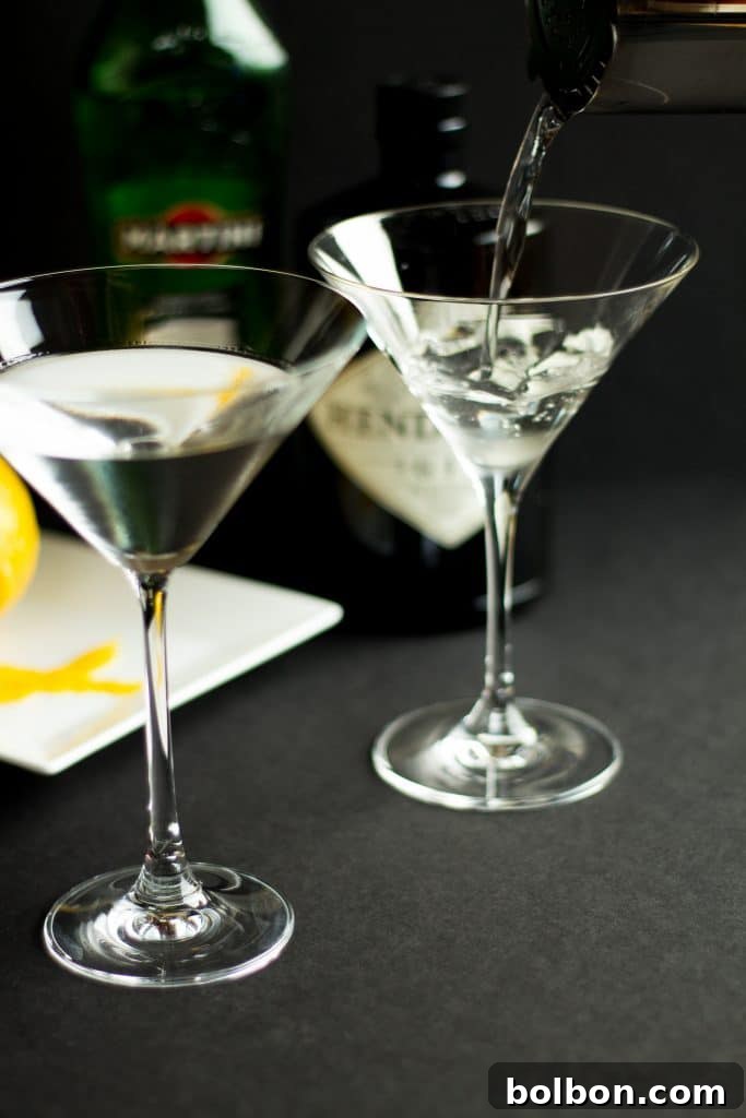 Preparing a Gin Martini with a lemon twist