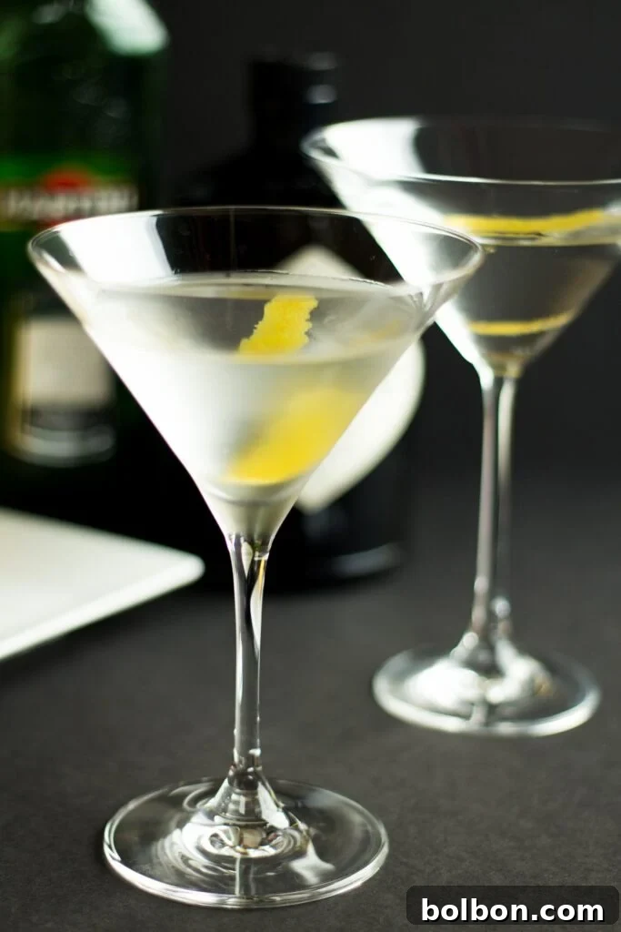 A chilled Martini glass filled with ice and water