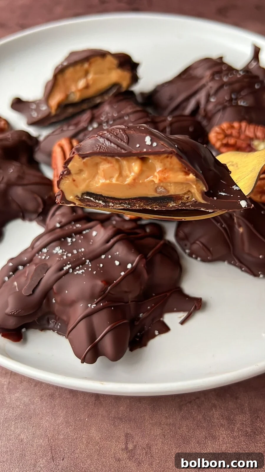 Healthy Chocolate Covered Turtles with dates, pecans, and nut butter, drizzled with chocolate and sea salt.