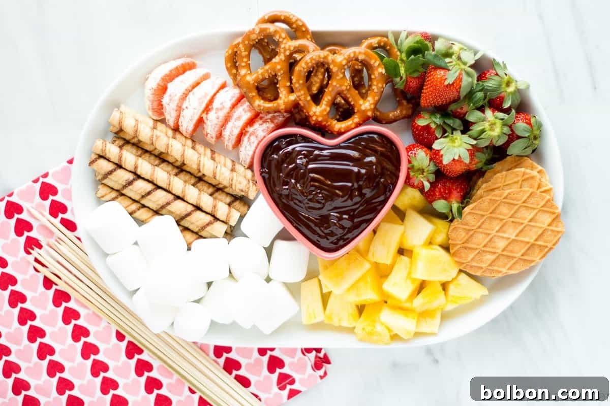 Rich and easy chocolate fondue with fresh strawberries and marshmallows, perfect for a romantic Valentine's Day or party dessert, no special pot needed.