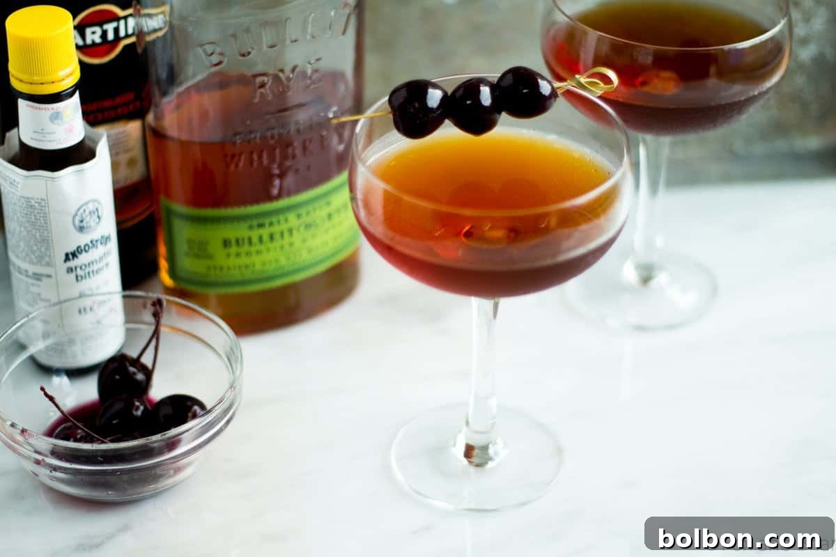 Crafting the Timeless Manhattan 2 A perfectly stirred Classic Manhattan cocktail, served in a chilled coupe glass and garnished with a rich Luxardo cherry.