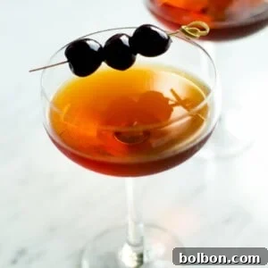 Crafting the Timeless Manhattan 7 Classic Manhattan cocktail garnished with a Luxardo cherry.