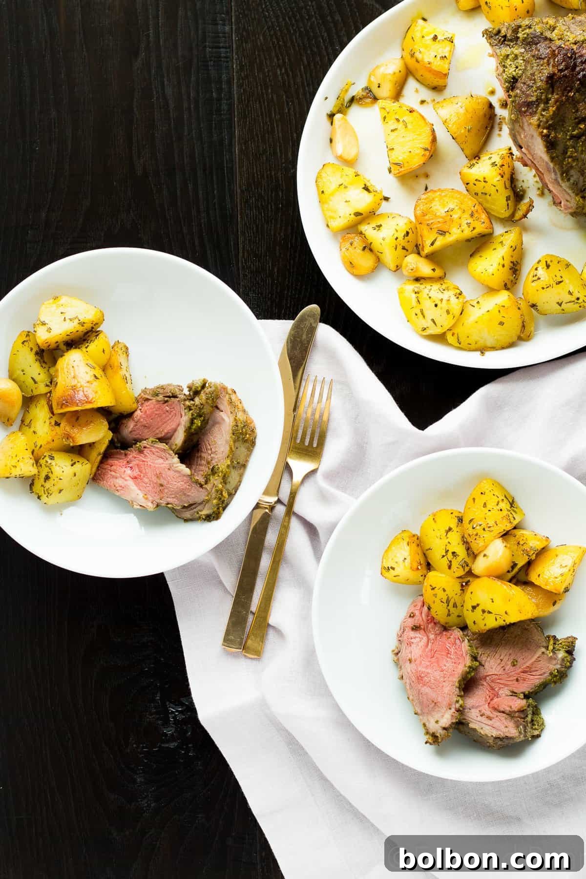 Beautifully presented Fresh Herb Boneless Leg of Lamb, sliced and ready to serve.