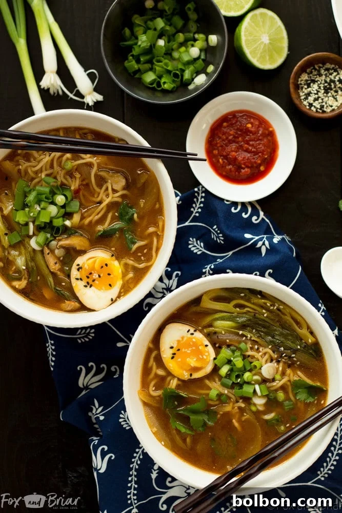 Quick Homemade Chicken Ramen 3 Close-up of a bowl of Easy Chicken Ramen with noodles, chicken, and a soft-boiled egg.