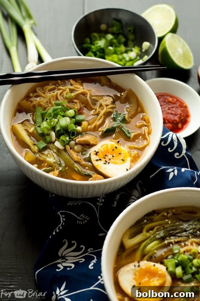 Quick Homemade Chicken Ramen 7 A beautiful, soft-boiled ramen egg with a runny yolk, ready to top the ramen bowl.