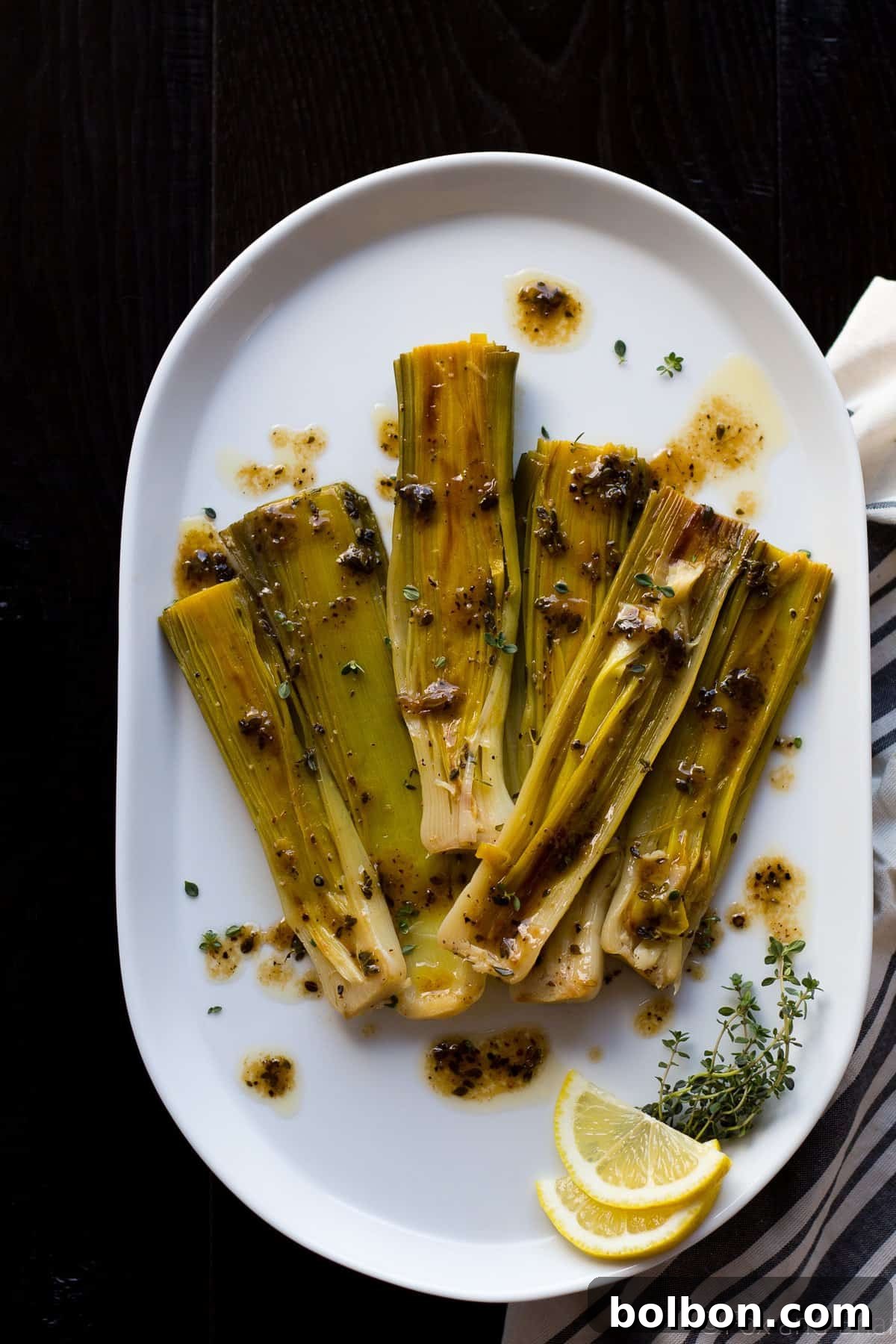 Velvety Braised Leeks 9 A vibrant platter of braised leeks beautifully presented, ready for a spring meal.