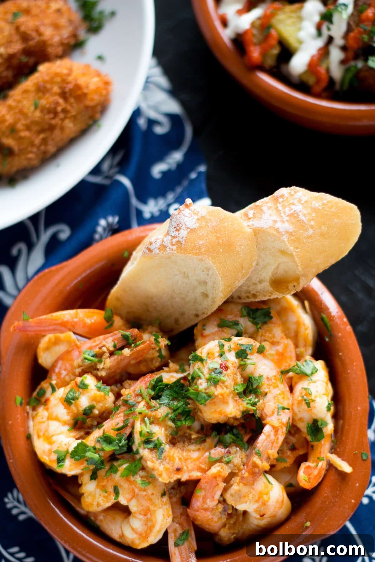 Close-up of Garlic Shrimp (Gambas al Ajillo) in a rustic serving dish