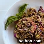 This Spicy Peanut Quinoa Salad is vegan and gluten free. Awesome to make ahead and bring to a party.