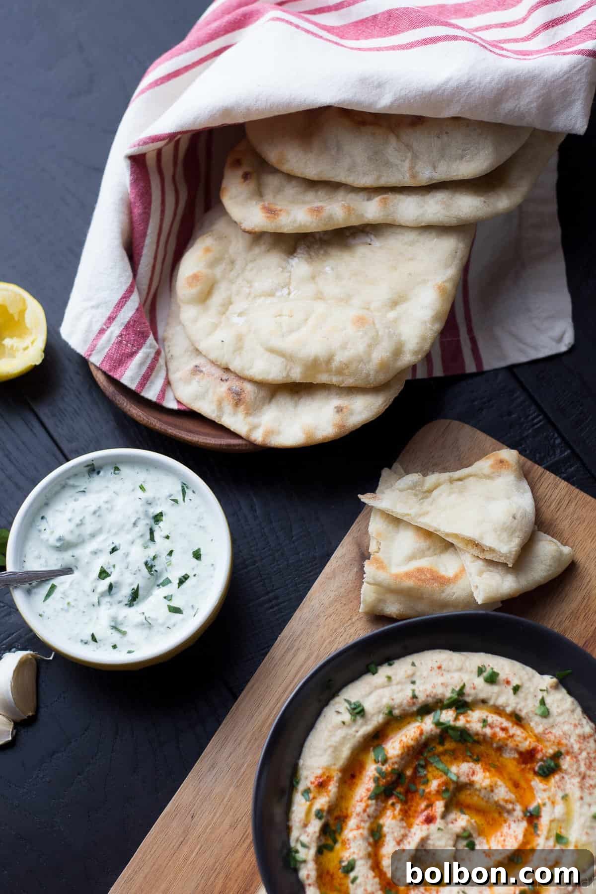 Pita bread actively puffing up in a very hot oven