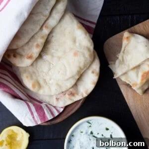 Beautifully stacked homemade pita bread, ready to serve