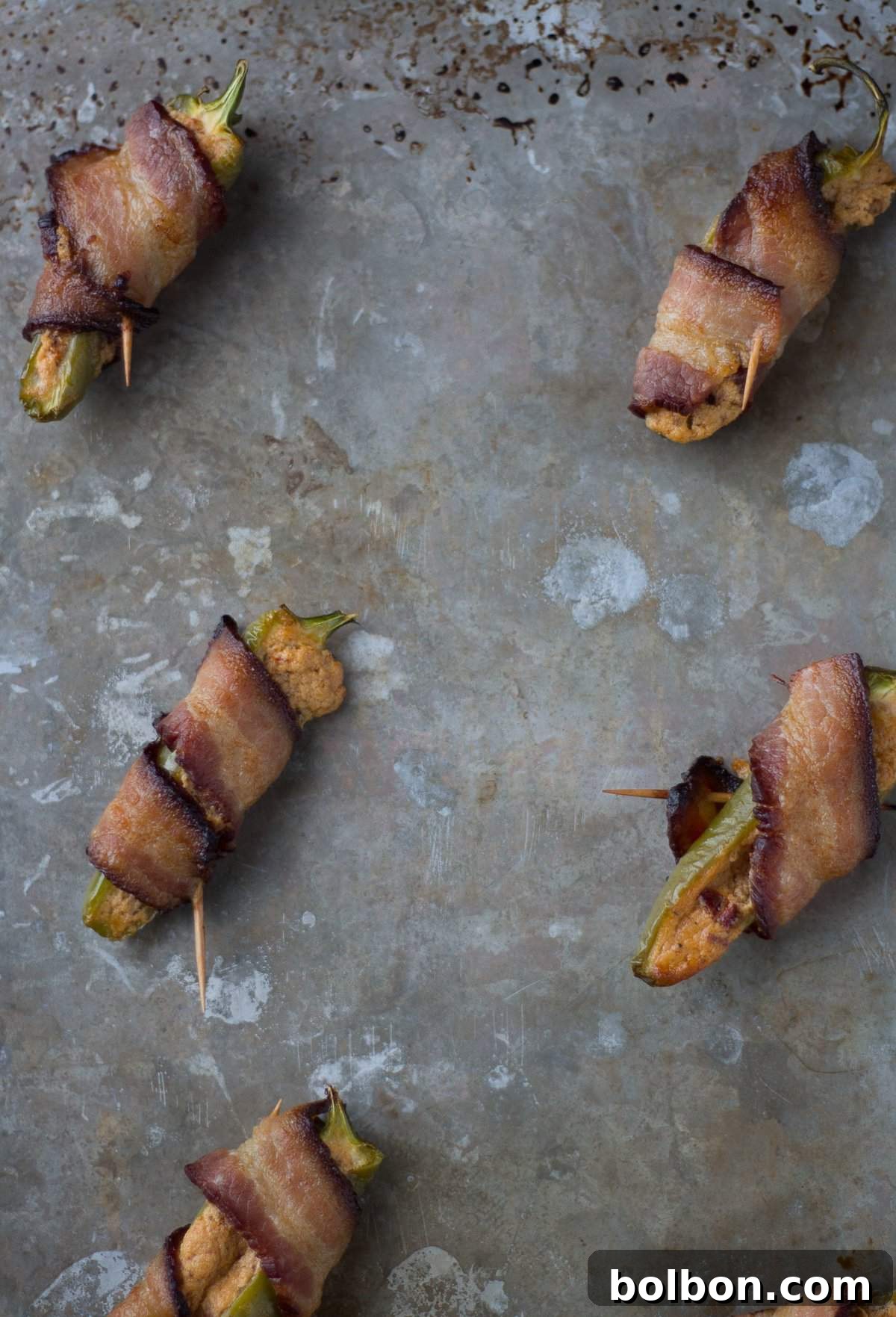 A tray of freshly baked honey chipotle jalapeno poppers, golden and ready to serve.