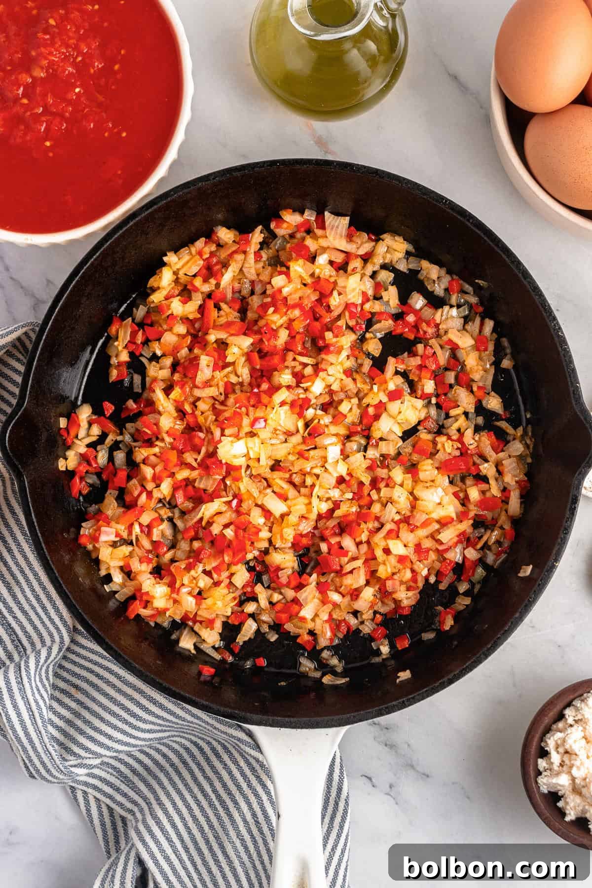 A skillet with the sautéed veggies. 