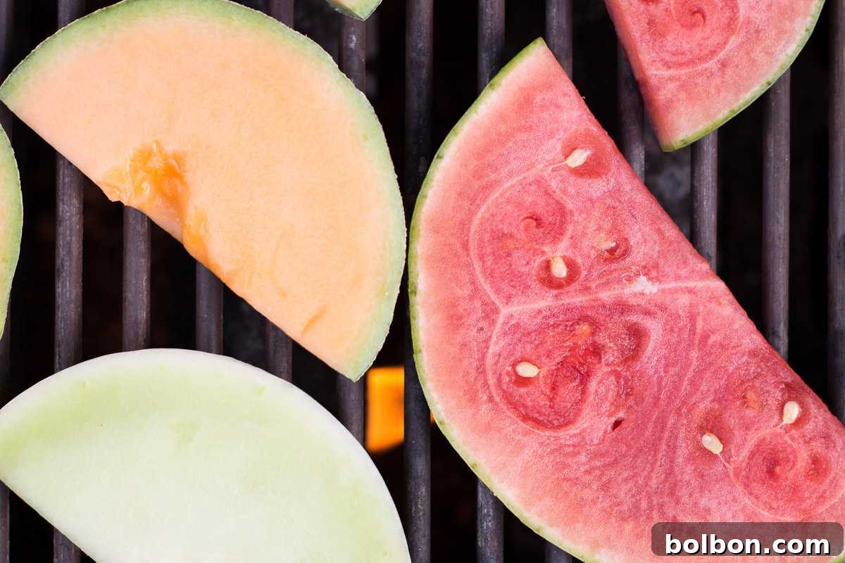 Close-up of golden-brown grill marks on fresh melon slices, ready for a gourmet salad