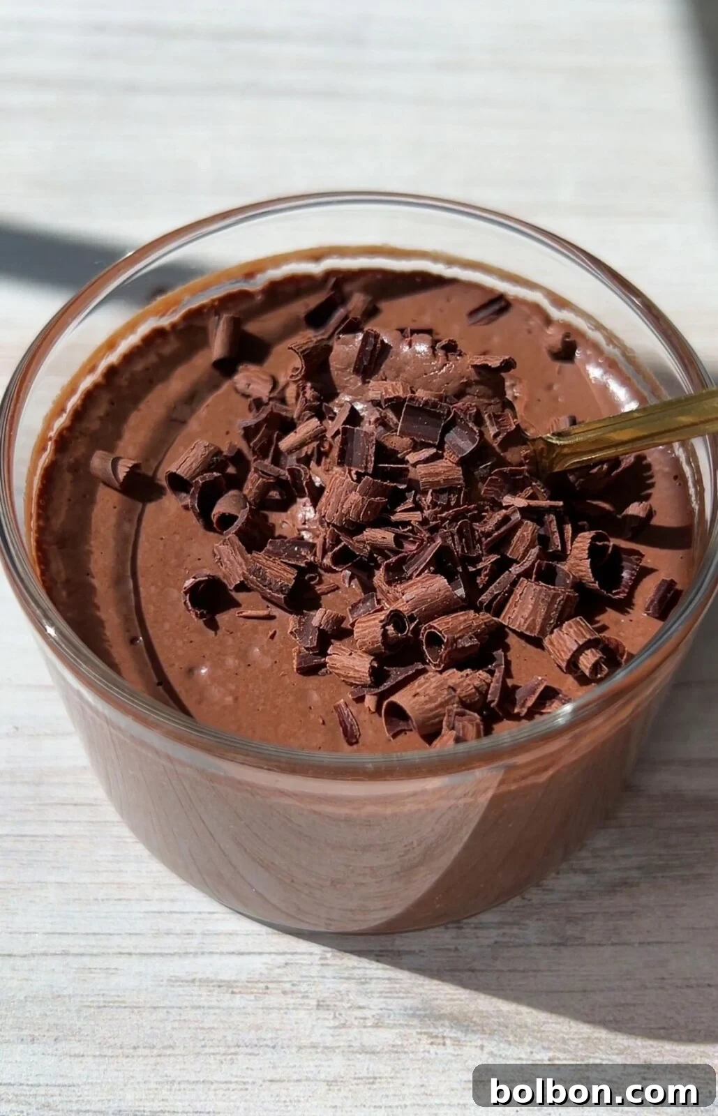 Magic One-Ingredient Chocolate Mousse 2 Decadent One Ingredient Chocolate Mousse served in a glass ramekin, topped with chocolate shavings, ready to enjoy.