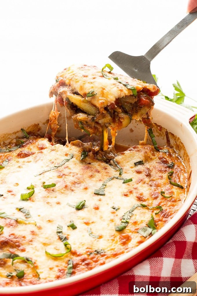 Earthy Mushroom & Zucchini Lasagna 4 Mushroom Zucchini Lasagna ready for baking, showcasing the layers of zucchini, mushrooms, and cheese.