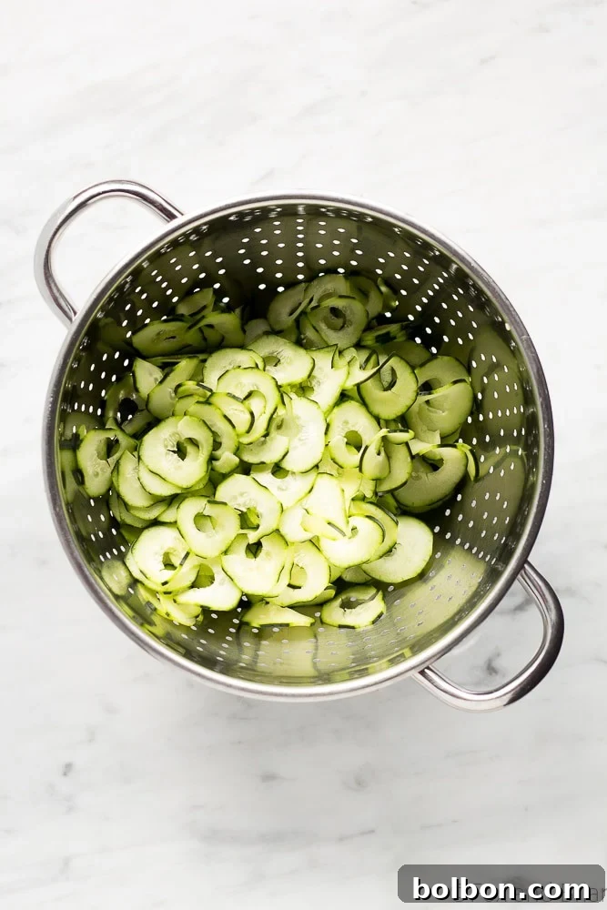 Preparing fresh cucumbers for the no-cook Sesame Carrot and Cucumber Slaw.