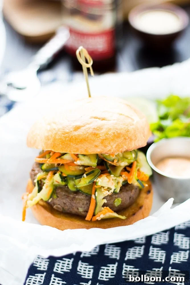 Delicious Asian Bison Burgers stacked high with fresh slaw and spicy aioli