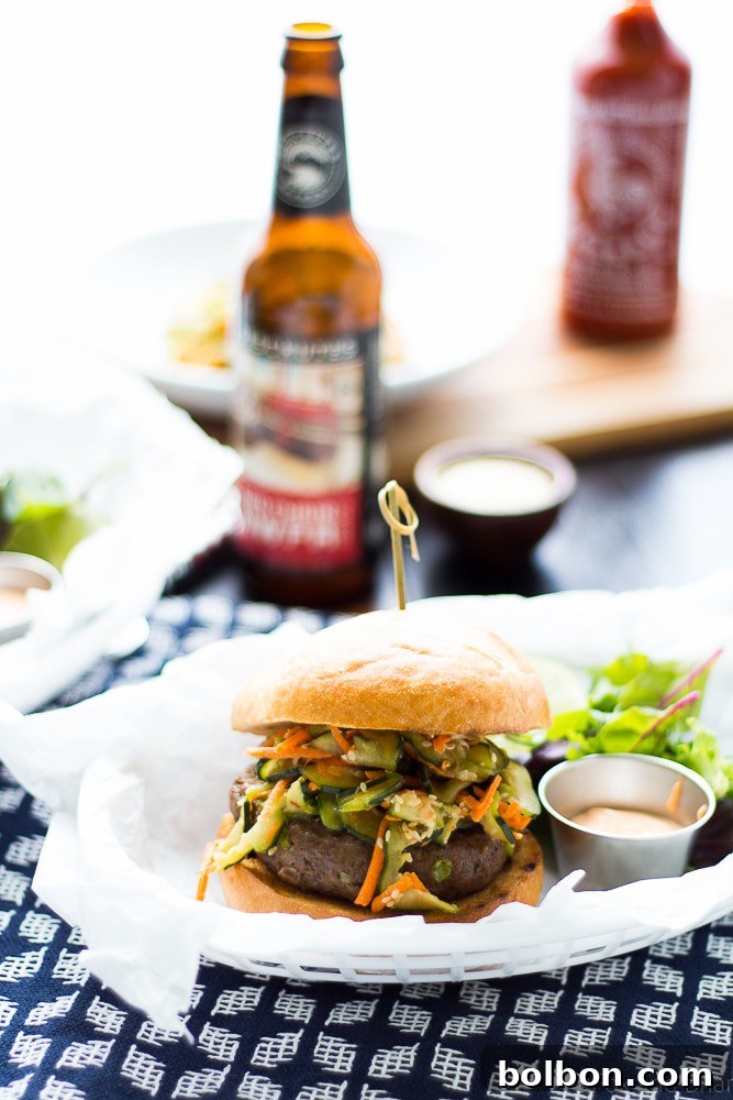Close-up of a grilled Asian Bison Burger patty, showcasing its rich texture and spices