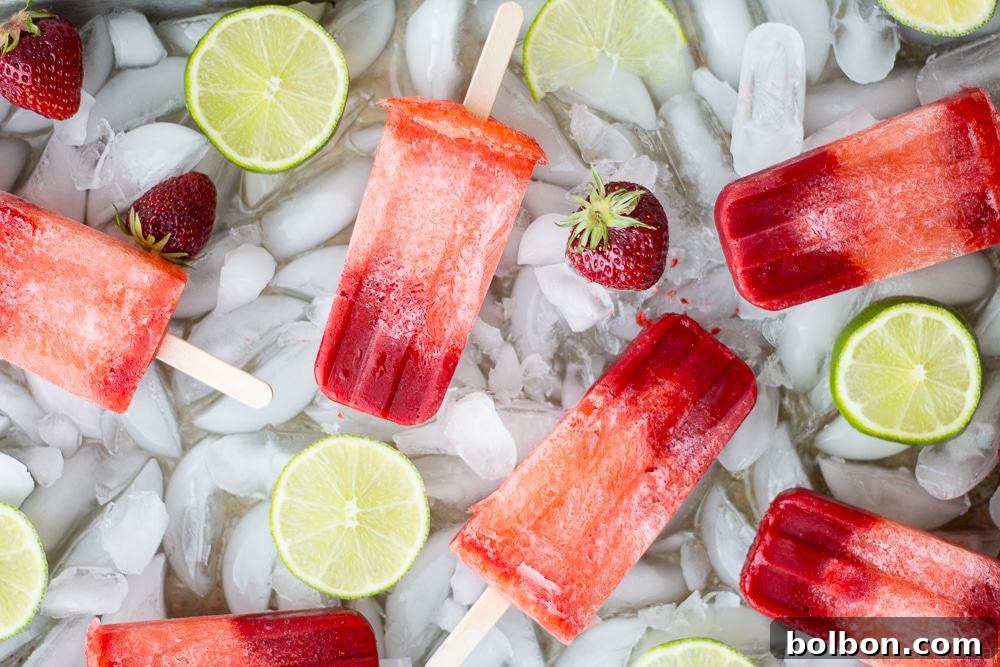 Zesty Strawberry Lime Pops 2 Refreshing Strawberry Lime Popsicles with fresh ingredients on a hot day