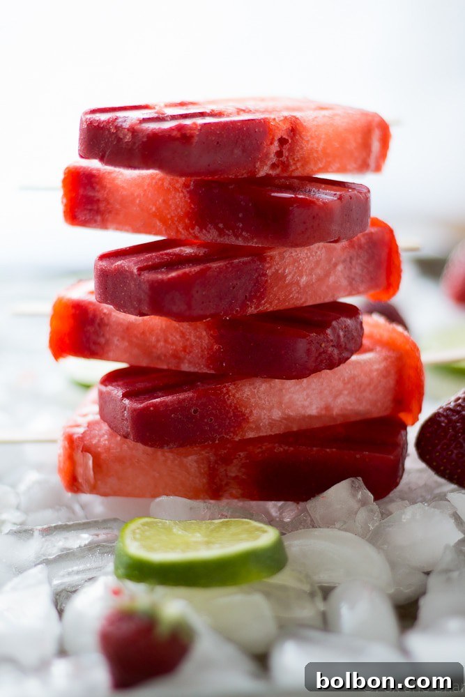 Zesty Strawberry Lime Pops 4 Partially eaten Strawberry Lime Popsicle showcasing its beautiful colors