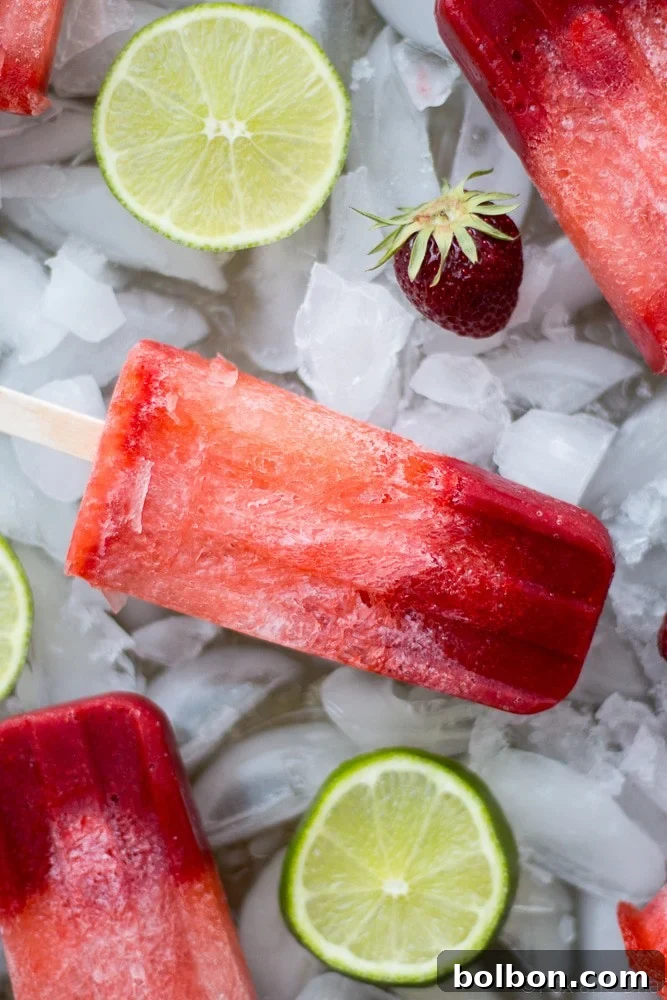 Zesty Strawberry Lime Pops 6 Collection of fresh ingredients for Strawberry Lime Popsicles: strawberries, limes, and a bottle of soda