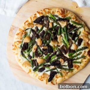 Asparagus and Morel Pizza with Garlic Confit, a vibrant and flavorful vegetarian dish.