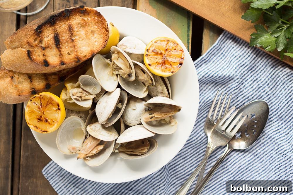 Beer Steamed Clams recipe, perfect for campfire cooking or stovetop preparation. Fresh clams cooked in beer, butter, and garlic for a delicious and easy meal.