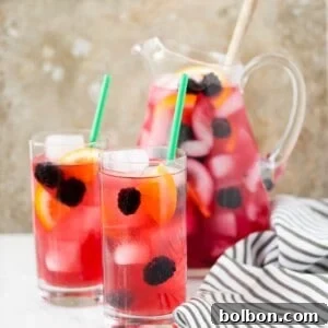 This Berry Sangria Iced Tea is a take on the Starbucks drink! Herbal iced tea mixed with a berry orange syrup, apple juice and blackberries! So refreshing for a hot summer day.
