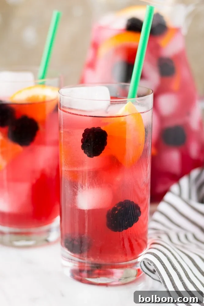 A final close-up of a Berry Sangria Iced Tea glass, with vibrant colors and fruit, ready to be enjoyed.