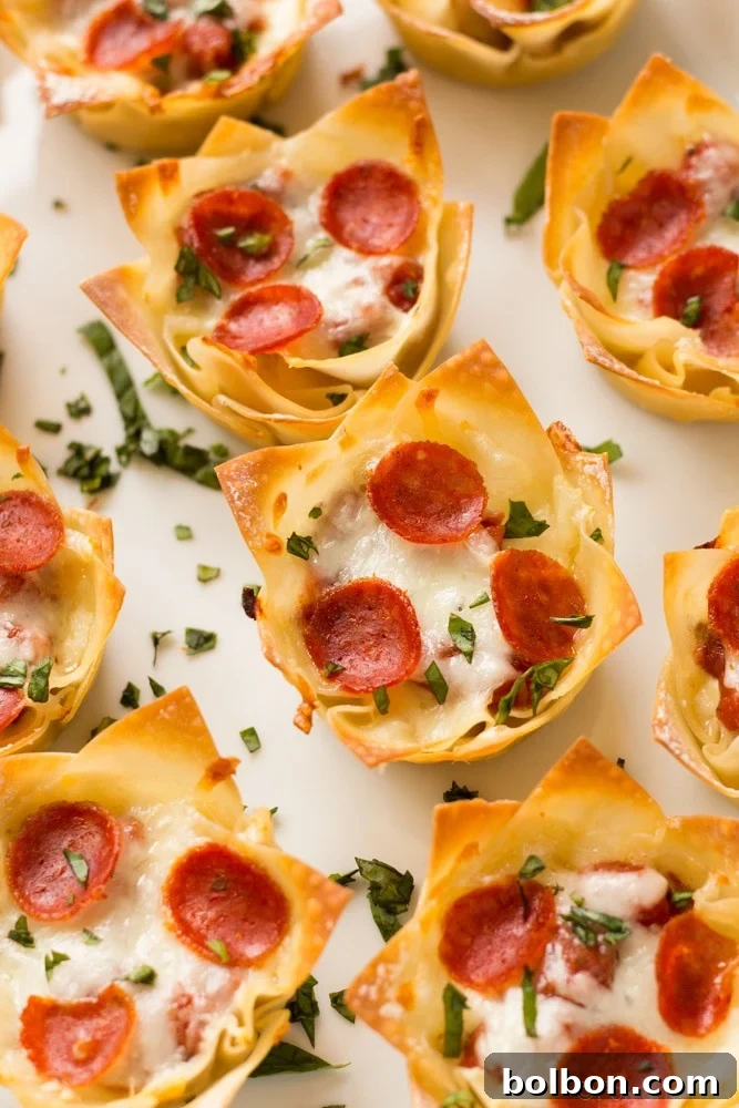 Delicious Mini Pizza Dip Cups served on a white platter, ready for sharing.