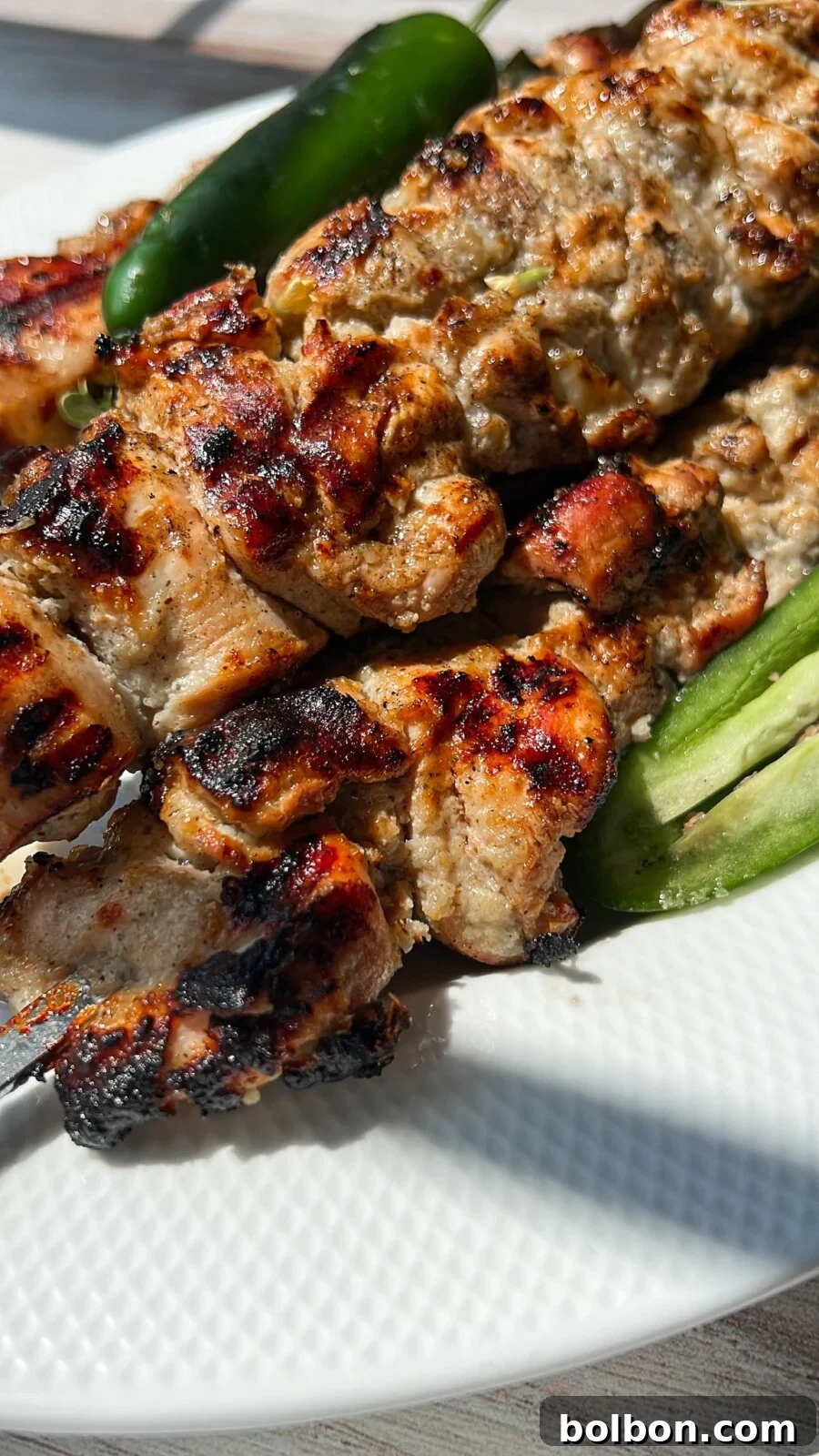 Lemon Herb Roasted Chicken 3 Grilled Whole Lemon Chicken skewers served on a platter, ready to eat