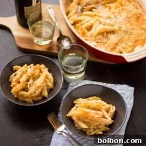 The ultimate Four Cheese Truffle Mac and Cheese, golden and bubbly, ready to be served.