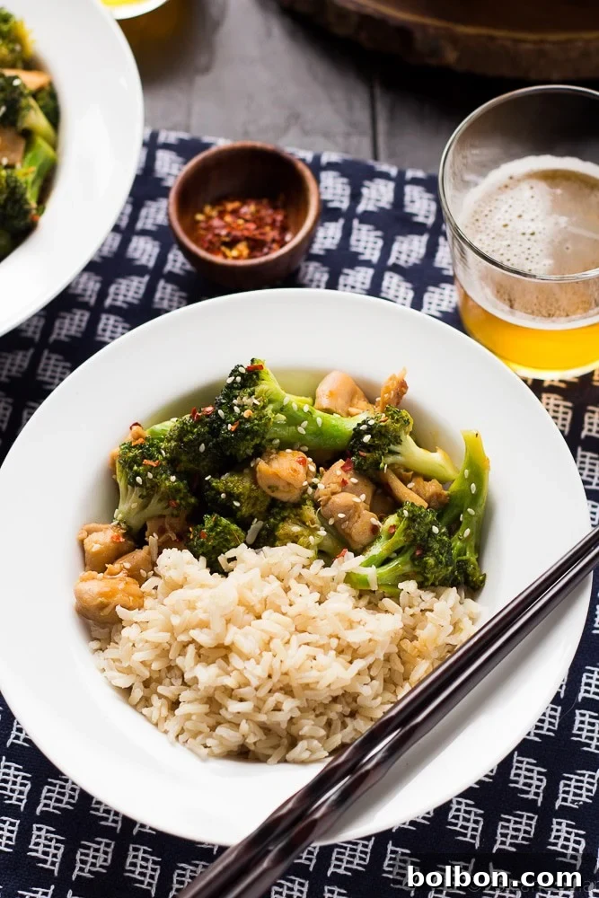 Freshly cooked orange chicken and broccoli ready to be served