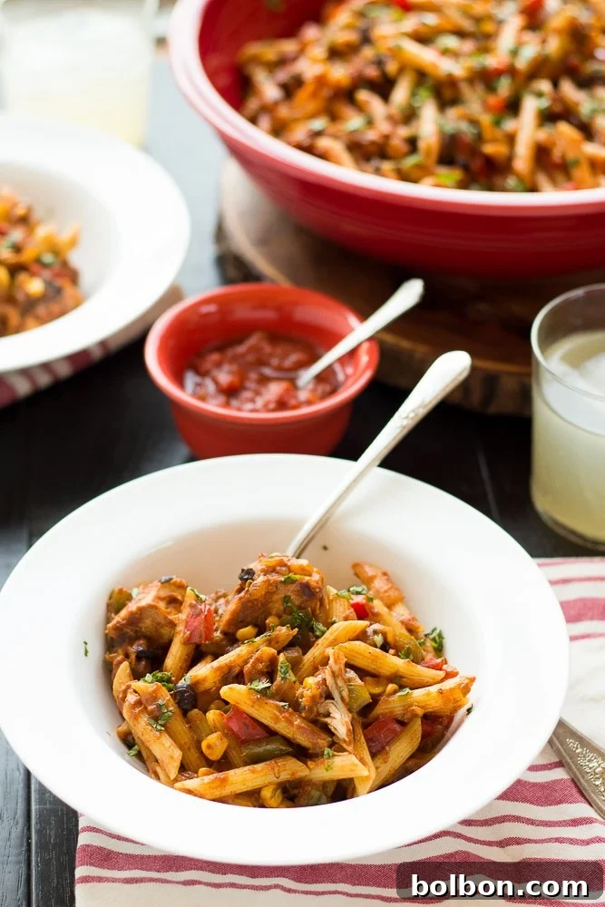 The Ultimate Chicken Taco Pasta And a Giveaway 5 A close-up of Chicken Taco Pasta being served, showing the steam rising from the hot and fresh dish, inviting you to take a bite. A great recipe for a healthy pasta month.