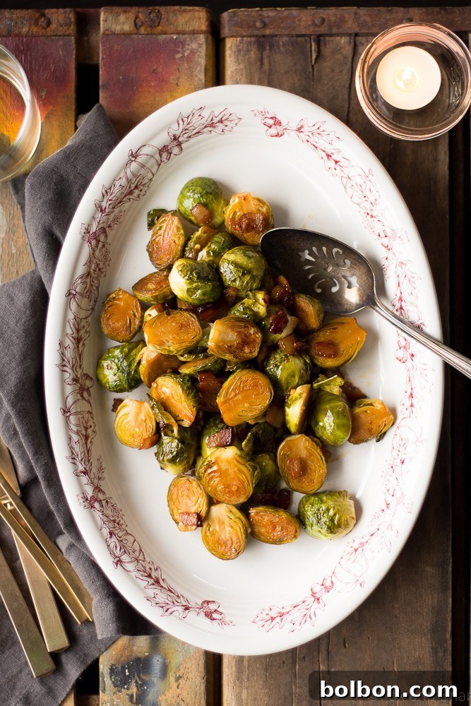 A vibrant platter of Maple Bacon Roasted Brussels Sprouts, perfect for a holiday gathering.