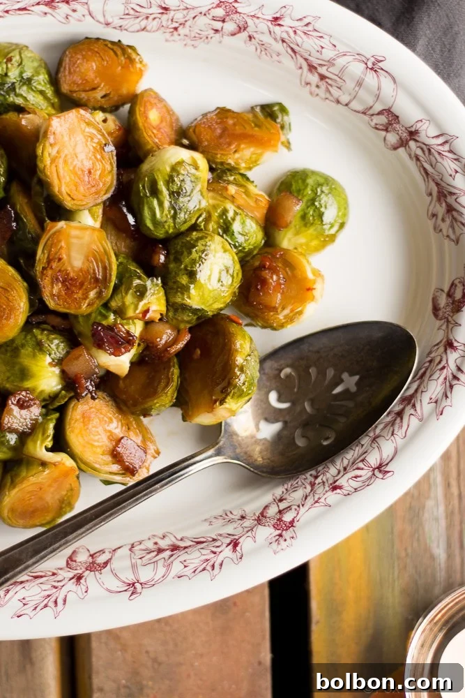 Another perspective of the flavorful Maple Bacon Roasted Brussels Sprouts, showcasing the tender sprouts and crispy bacon.