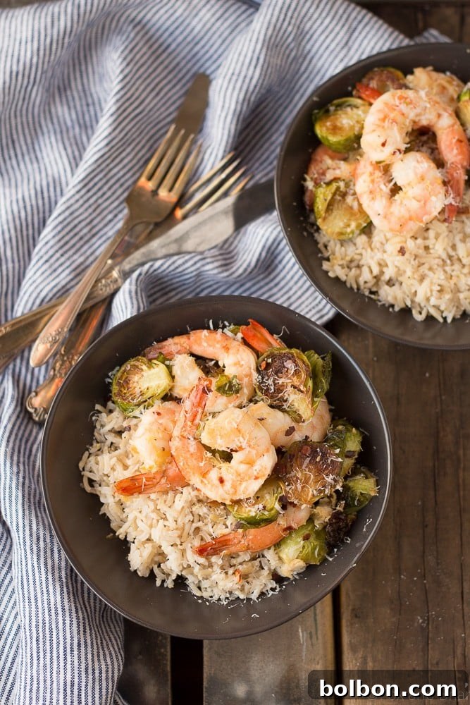 A close-up shot of the vibrant roasted shrimp and Brussels sprouts, ready for serving.