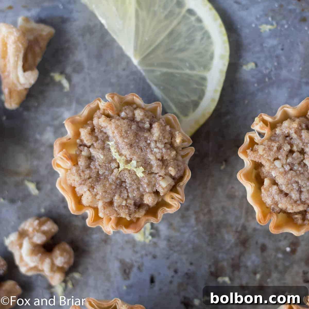 Effortless Mini Baklava Delights 2 Delicious Mini Baklava Cups, a perfect bite-sized dessert with walnuts and sweet syrup