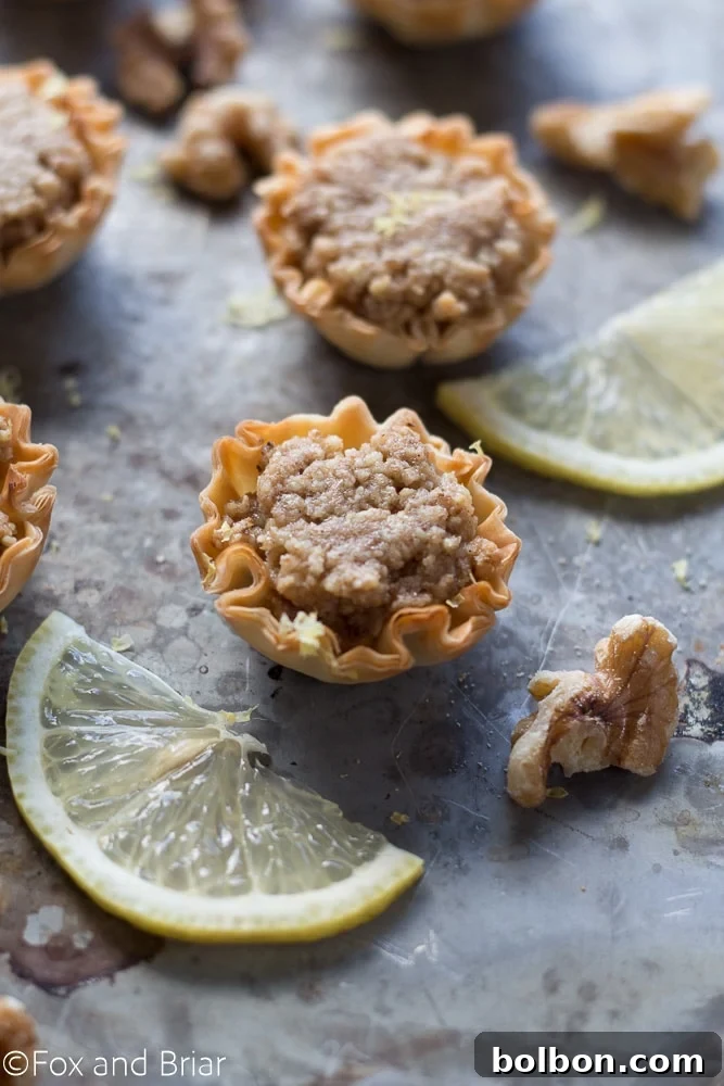 Effortless Mini Baklava Delights 5 A selection of Mini Baklava Cups garnished with chopped walnuts, showcasing their perfect serving size