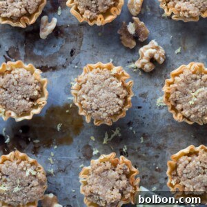 A top-down view of freshly baked Mini Baklava Cups, glistening with syrup