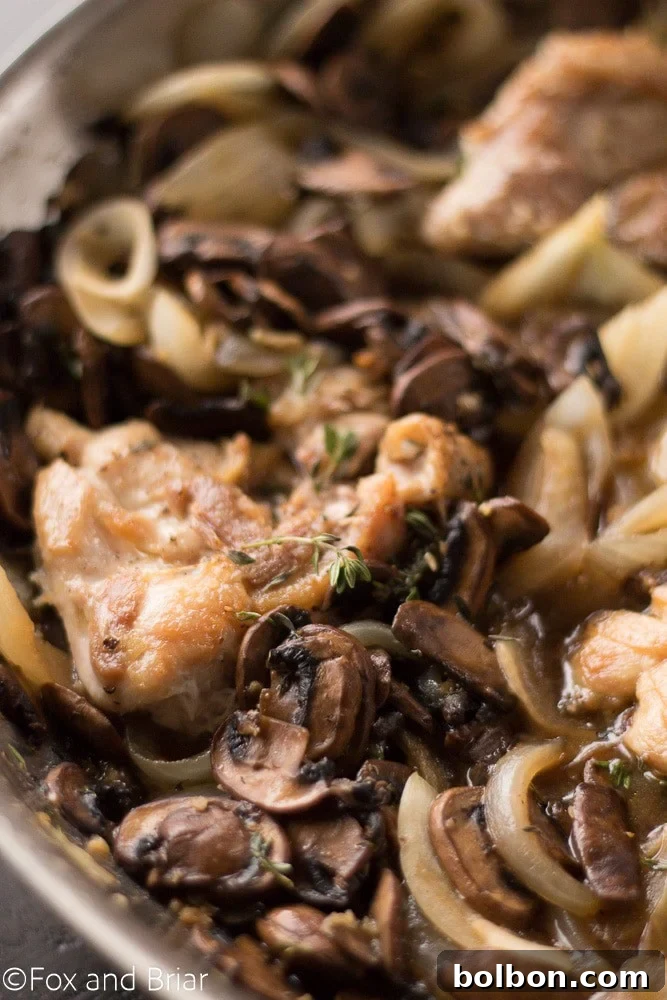 Skillet Chicken with Wine-Kissed Mushrooms 4 A vibrant plate of Skillet Chicken and White Wine Mushrooms, perfect for a quick and impressive dinner.