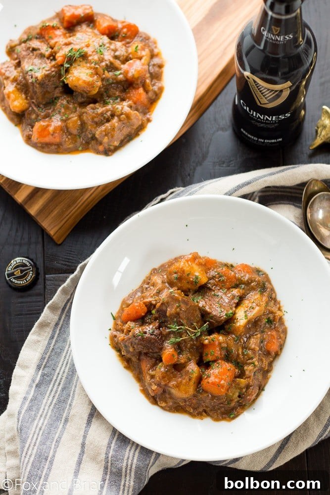 Guinness-Laced Irish Beef Stew 4 A hearty bowl of Irish Guinness Beef Stew with fresh parsley garnish, ready to be served.