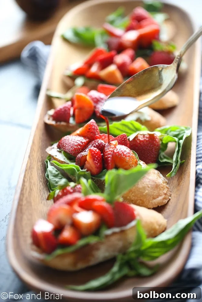 A stack of Strawberry Chambord Whipped Cheese Toasts, garnished with basil